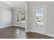 Home office with hardwood floors and a window overlooking the yard at 3807 Lockaby Way, Lawrenceville, GA 30044