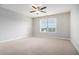 Spacious bedroom with a window and ceiling fan at 420 Silver Brook Dr, Woodstock, GA 30188