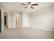 Bright bedroom with carpet, ceiling fan and access to hallway at 420 Silver Brook Dr, Woodstock, GA 30188