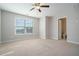 Spacious bedroom with private bathroom access and ceiling fan at 420 Silver Brook Dr, Woodstock, GA 30188