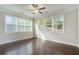 Bright bedroom with hardwood floors and large windows, providing ample natural light at 420 Silver Brook Dr, Woodstock, GA 30188