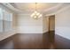 Elegant dining room featuring hardwood floors and wainscoting at 420 Silver Brook Dr, Woodstock, GA 30188