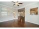 Sunlit dining area with hardwood floors and access to the kitchen and living areas at 420 Silver Brook Dr, Woodstock, GA 30188