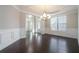 Bright dining room with hardwood floors and chandelier at 420 Silver Brook Dr, Woodstock, GA 30188