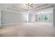 Large main bedroom with carpeted floors and a tray ceiling at 420 Silver Brook Dr, Woodstock, GA 30188