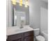 Clean bathroom with dark vanity, white toilet, and white subway tile at 4223 Deming Cir, Atlanta, GA 30342