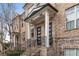 Brick front of townhome with front steps and porch at 4223 Deming Cir, Atlanta, GA 30342