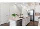 Modern kitchen island with granite countertop and stainless steel sink at 4223 Deming Cir, Atlanta, GA 30342