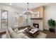 Living room with fireplace, chandelier, and access to outdoor deck at 4223 Deming Cir, Atlanta, GA 30342