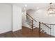 Elegant staircase with dark wood and metal railing at 4223 Deming Cir, Atlanta, GA 30342