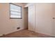 Cozy bedroom with window, closet, and neutral walls at 785 Jett Rd, Jonesboro, GA 30236