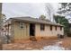 Brick house with green siding and a backyard at 785 Jett Rd, Jonesboro, GA 30236