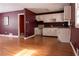 Simple kitchen with white cabinets and laminate flooring at 785 Jett Rd, Jonesboro, GA 30236