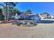 House exterior showcasing landscaping and a storage shed at 340 Annslee Cir, Loganville, GA 30052