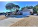 House exterior with a two-car garage and landscaping at 340 Annslee Cir, Loganville, GA 30052