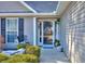 Welcoming entrance with a glass front door, sidelight windows, and decorative plantings at 340 Annslee Cir, Loganville, GA 30052