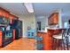 View of kitchen with island, breakfast bar, and hardwood floors at 340 Annslee Cir, Loganville, GA 30052