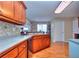 Spacious kitchen with cherry cabinets and stainless steel appliances at 340 Annslee Cir, Loganville, GA 30052