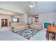 Cozy living room with plush sofas, a patterned rug, and a vaulted ceiling with a ceiling fan at 340 Annslee Cir, Loganville, GA 30052