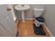 Small half bathroom with pedestal sink and toilet at 5146 Manerdale Se Dr # 4, Atlanta, GA 30339