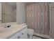 Clean bathroom with pedestal sink and patterned shower curtain at 5146 Manerdale Se Dr # 4, Atlanta, GA 30339