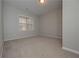 Spacious bedroom with neutral carpeting and large window at 5146 Manerdale Se Dr # 4, Atlanta, GA 30339