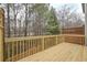 Spacious deck overlooks wooded area, offering a peaceful view at 5146 Manerdale Se Dr # 4, Atlanta, GA 30339