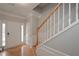 Bright entry with hardwood floors, staircase, and neutral paint at 5146 Manerdale Se Dr # 4, Atlanta, GA 30339