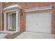 White garage door with brick exterior at 5146 Manerdale Se Dr # 4, Atlanta, GA 30339