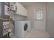 Laundry room with washer, dryer, and exterior access at 5146 Manerdale Se Dr # 4, Atlanta, GA 30339