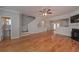 Open living room with hardwood floors and a half bath at 5146 Manerdale Se Dr # 4, Atlanta, GA 30339