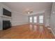 Large living room with hardwood floors, fireplace, and lots of natural light at 5146 Manerdale Se Dr # 4, Atlanta, GA 30339