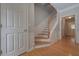 Elegant staircase with wood treads and white railings at 5146 Manerdale Se Dr # 4, Atlanta, GA 30339