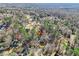 Wide aerial view showing home's location in a residential neighborhood at 5220 Otter Creek Run, Cumming, GA 30040