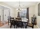 Bright dining room featuring a wood table and six chairs at 5220 Otter Creek Run, Cumming, GA 30040