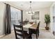 Spacious dining room with a large wood table and six chairs at 5220 Otter Creek Run, Cumming, GA 30040