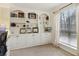 Home office with built-in white shelving and cabinets at 5220 Otter Creek Run, Cumming, GA 30040