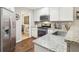 Modern kitchen with stainless steel appliances and granite countertops at 5220 Otter Creek Run, Cumming, GA 30040