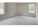 Bright bedroom with gray carpet and a window at 746 Trevett Way, Marietta, GA 30062