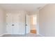 Bedroom with carpet floor, double door closet, and neutral color at 746 Trevett Way, Marietta, GA 30062