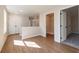 Hallway with wood flooring and view of carpeted bedroom through doorway at 746 Trevett Way, Marietta, GA 30062