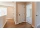 Hallway with wood floors that leads to bedroom that has carpet floors at 746 Trevett Way, Marietta, GA 30062