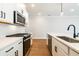 Well-appointed kitchen featuring stone countertops, tile backsplash, and stylish hardware at 746 Trevett Way, Marietta, GA 30062