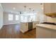 Open-concept kitchen with a kitchen island that flows into the living room at 746 Trevett Way, Marietta, GA 30062