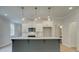 Open concept kitchen and dining area with gray island, white cabinets and hardwood floors at 746 Trevett Way, Marietta, GA 30062