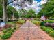 Attractive town square with brick pathways, lush landscaping, and American flags at 746 Trevett Way, Marietta, GA 30062