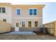 Backyard featuring a concrete patio and a brick facade along the back of the home at 754 Trevett Way, Marietta, GA 30062