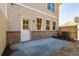 Backyard featuring a concrete patio and a brick facade along the back of the home at 754 Trevett Way, Marietta, GA 30062