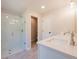 Bathroom featuring double vanity, walk-in shower, and access to a toilet area at 754 Trevett Way, Marietta, GA 30062