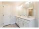 Modern bathroom with double sink vanity, a large mirror, and tiled floor at 754 Trevett Way, Marietta, GA 30062